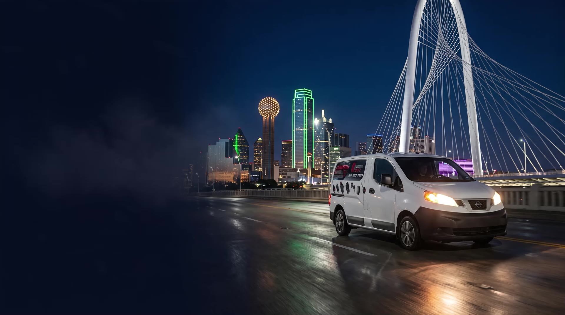 Smart Key Locksmith service van crossing the Margaret Hunt Hill Bridge in Dallas at night