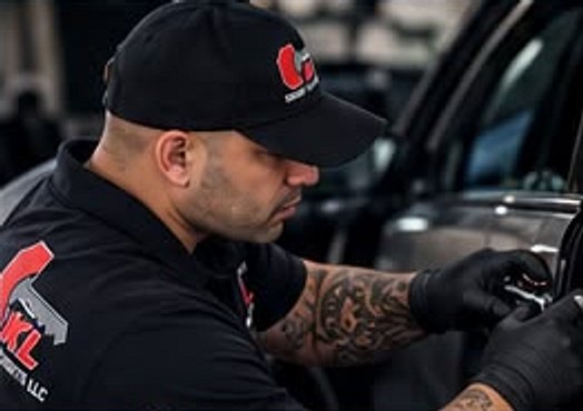 Technician unlocking a car door